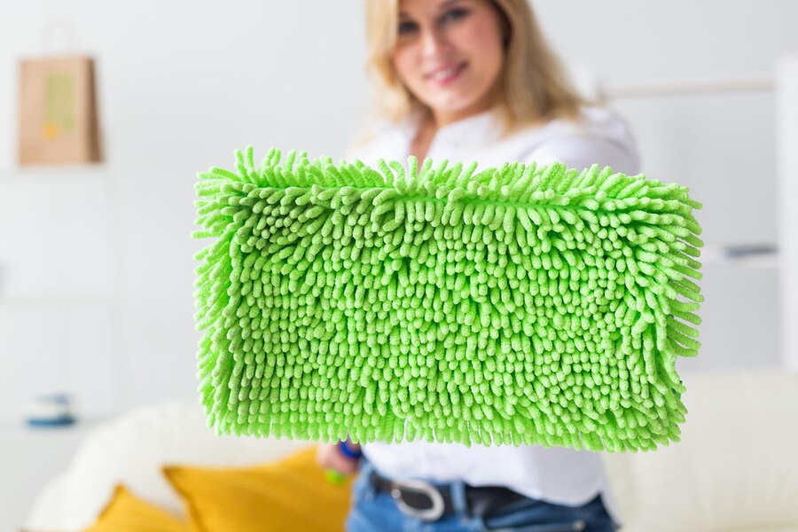 Green and Clean: Eco-Friendly Carpet Cleaning Tips for a Healthy Home - portrait-young-woman-standing-against-wall